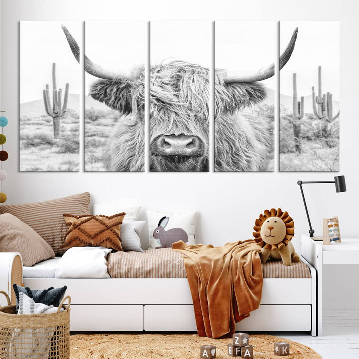 The "Rustic Charm | Cow Longhorn Black White Bighorn Wall Art Canvas Print" is a stunning triptych that showcases a highland cow with long horns set against a desert landscape with cacti in the background. This farmhouse wall art elevates any room into a rustic haven with its gallery-quality canvas.