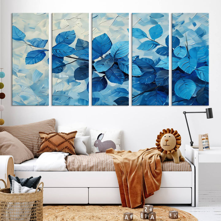 The contemporary living room is highlighted by the Abstract Blue Leaf Wall Art Canvas Print on the wall. The hand-assembled framed art enhances the room's vibrant decor, crafting a gallery-worthy ambience.