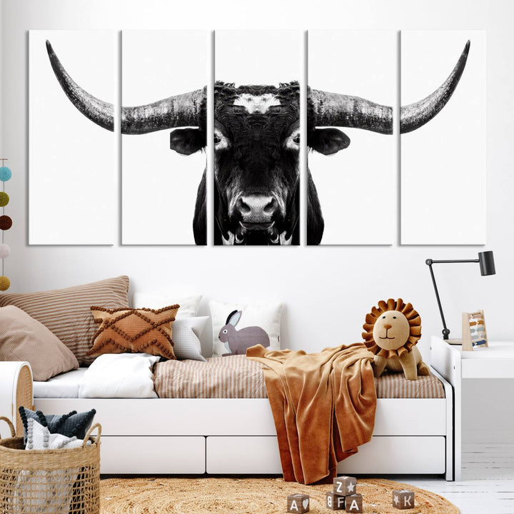 The living room is adorned with the Texas Cow Longhorn Wall Art Canvas Print in Black and White—framed and ready to hang.