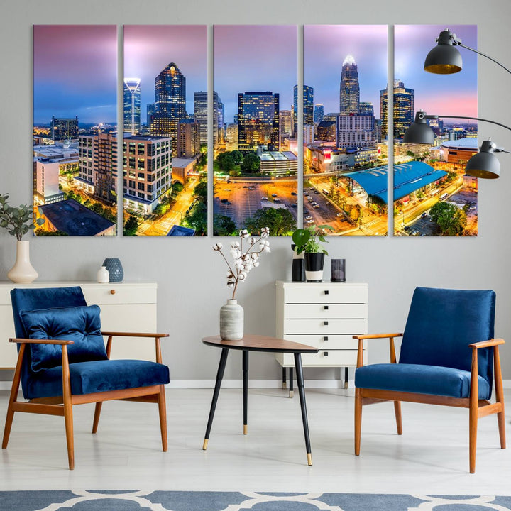 The living room features three large pieces of the *Charlotte City Lights Sunset Purple Skyline Cityscape View Wall Art Canvas Print*. Crafted on gallery-wrapped, museum-quality canvas with UV-protective coating, they grace the wall and add an artistic flair to the space.