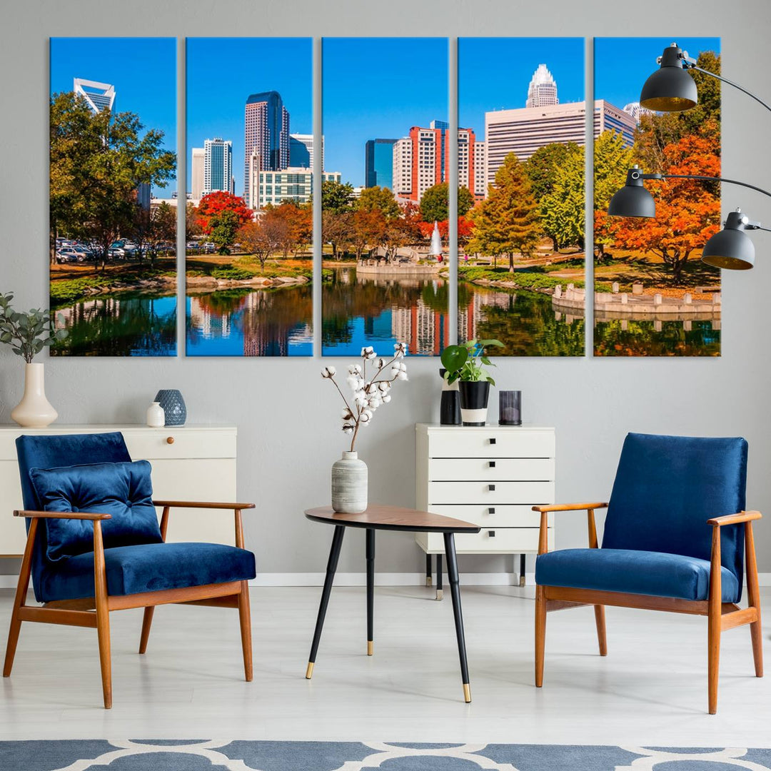 The Charlotte City Park at Fall Skyline Cityscape View wall art canvas print features a city panorama with a park and lake accented by autumn trees. It is mounted on museum-quality canvas with UV-protective coating and decorates the space.