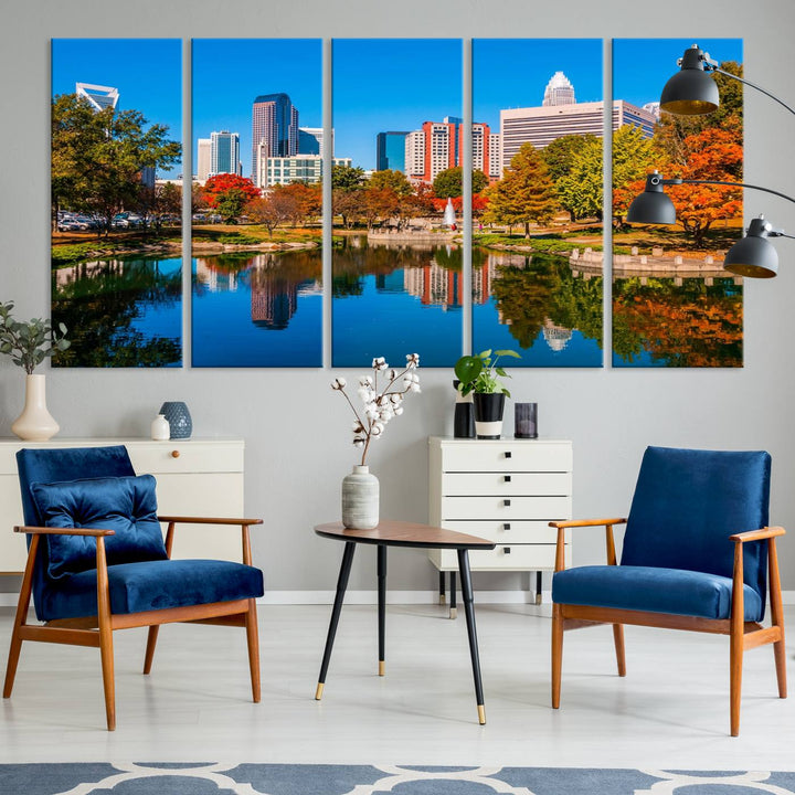 The "Charlotte City Autumn Morning Blue Skyline Cityscape View Wall Art Canvas Print" showcases a cityscape with vibrant autumn trees reflected in a lake. Its gallery-wrapped edges add depth to the scene, while the UV-protective coating ensures lasting brilliance.