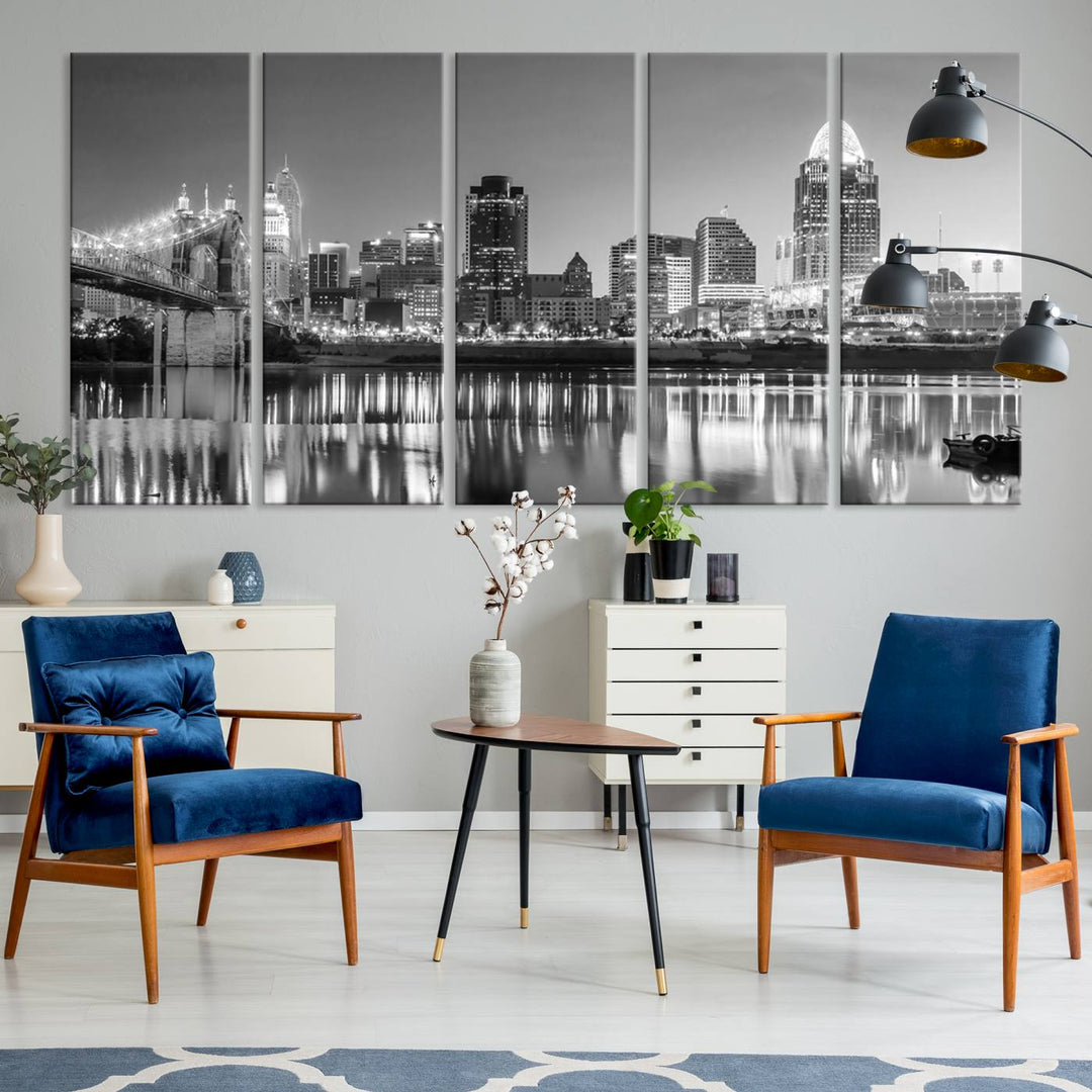 The "Cincinnati City Lights Skyline Black and White Wall Art Cityscape Canvas Print" is elegantly displayed in a stylish living room.