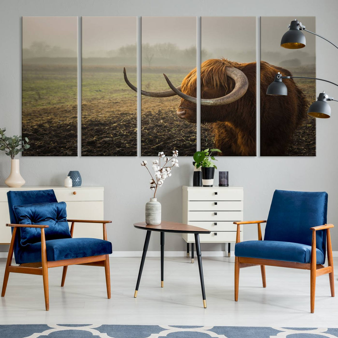 The "Big Cow Horn Wall Art Canvas Print" is a hand-assembled framed canvas depicting a Highland cow in a misty field. It is crafted with a UV-protective coating to ensure lasting vibrancy.