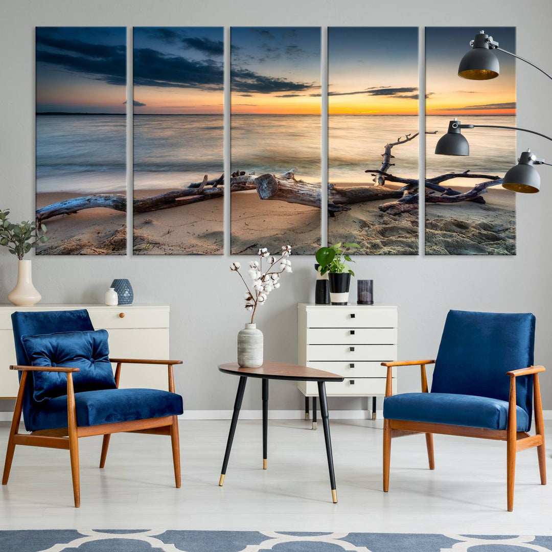 A captivating piece of Ocean Sunset Beach Wall Art Canvas Print, gallery wrapped, graces the gray wall.