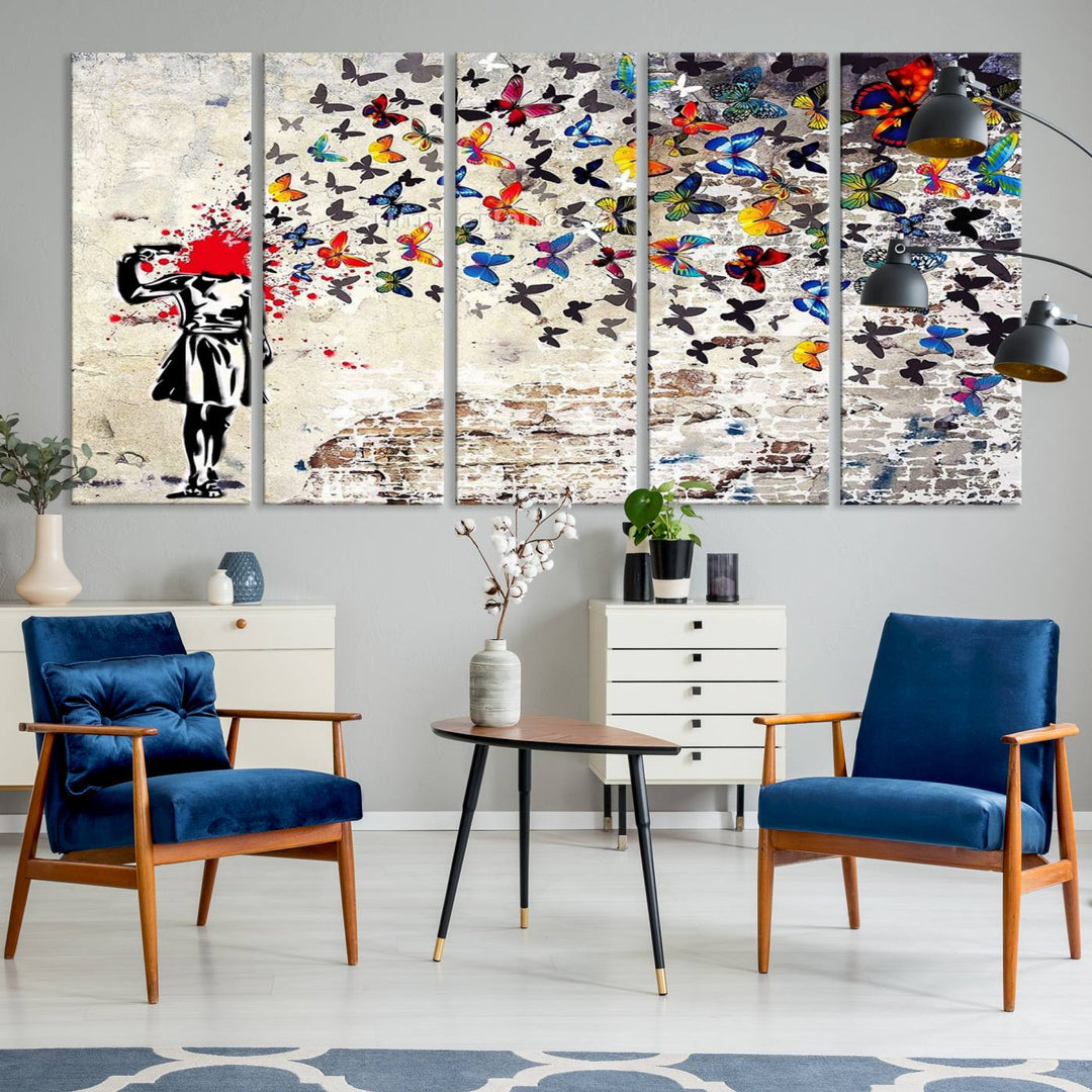 The Banksy Art Butterfly Girl Explosion Canvas showcases a dynamic figure with butterflies bursting from their head, set against a textured wall background. This vibrant urban graffiti piece is perfect for modern interiors and comes ready to hang.