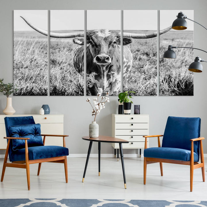 The Texas Cow Longhorn Wall Art Canvas Print is a black and white triptych depicting a cow in a field. It is crafted with museum-quality canvas and features a UV-protective coating.