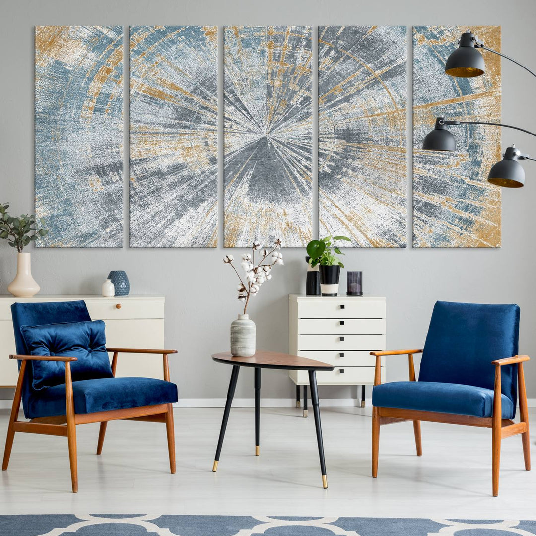 The Radiant Abstract Wood Rings Canvas Art, a modern triptych wall decor, enhances the contemporary style of the living room with its blue, white, and gold hues.