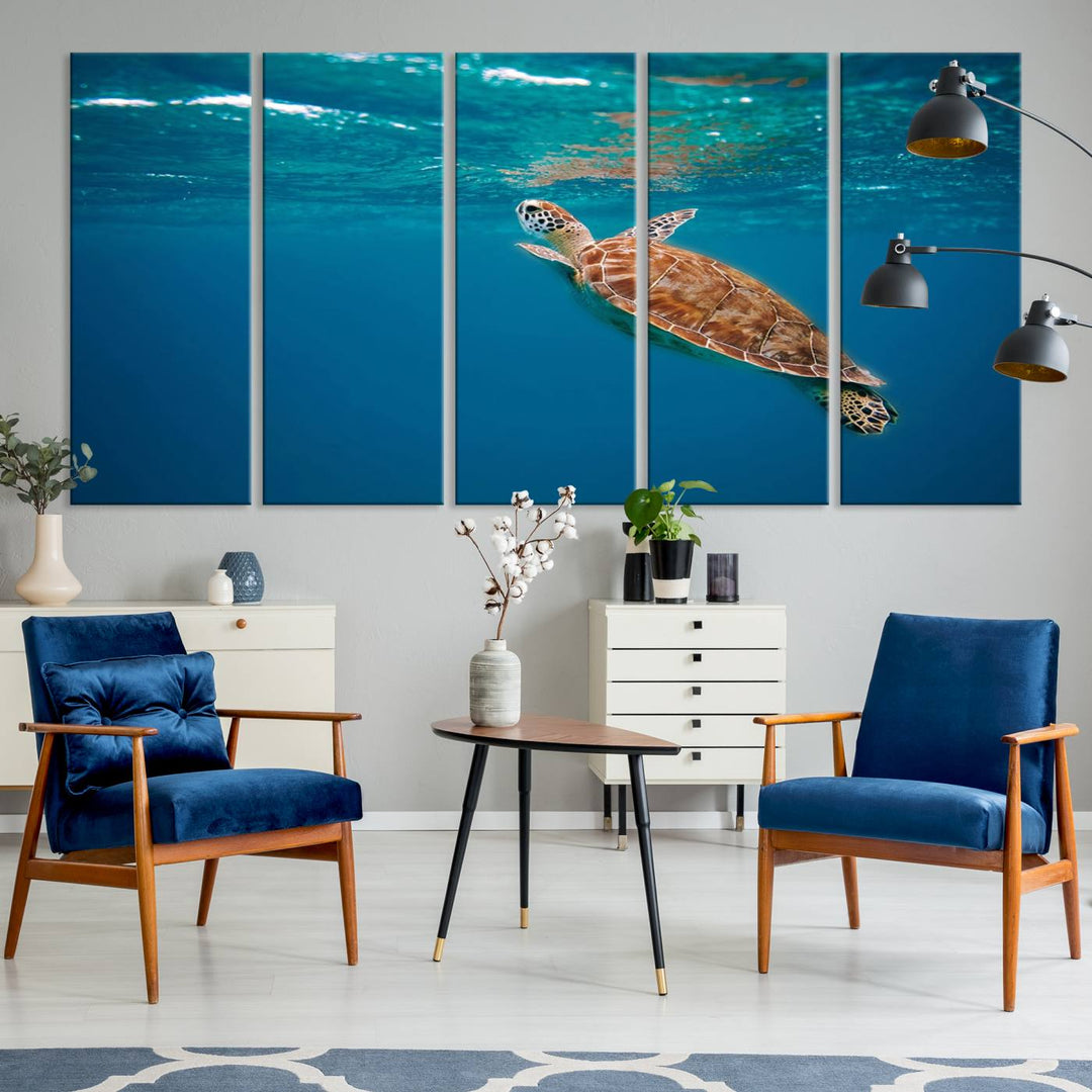 The living room features the "Baby Turtle in Ocean" wall art canvas print. This gallery-quality piece, depicting a sea turtle swimming underwater, adds an elegant touch to the space.