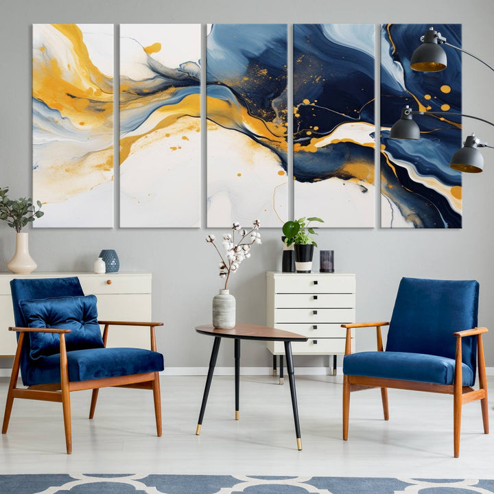 The Blue and Gold Abstract Fluid Canvas Art, with its swirling patterns, adorns the wall. This modern wall art beautifully complements the contemporary interior decor, adding an elegant touch with its rich blue, gold, and white tones.