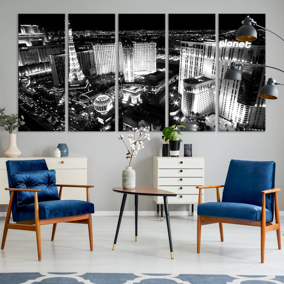 The Las Vegas Wall Art Canvas Print is a black and white triptych that showcases a city skyline at night. Crafted on museum-quality canvas with a UV-protective coating, it serves as an elegant and ready-to-hang focal point in the room.