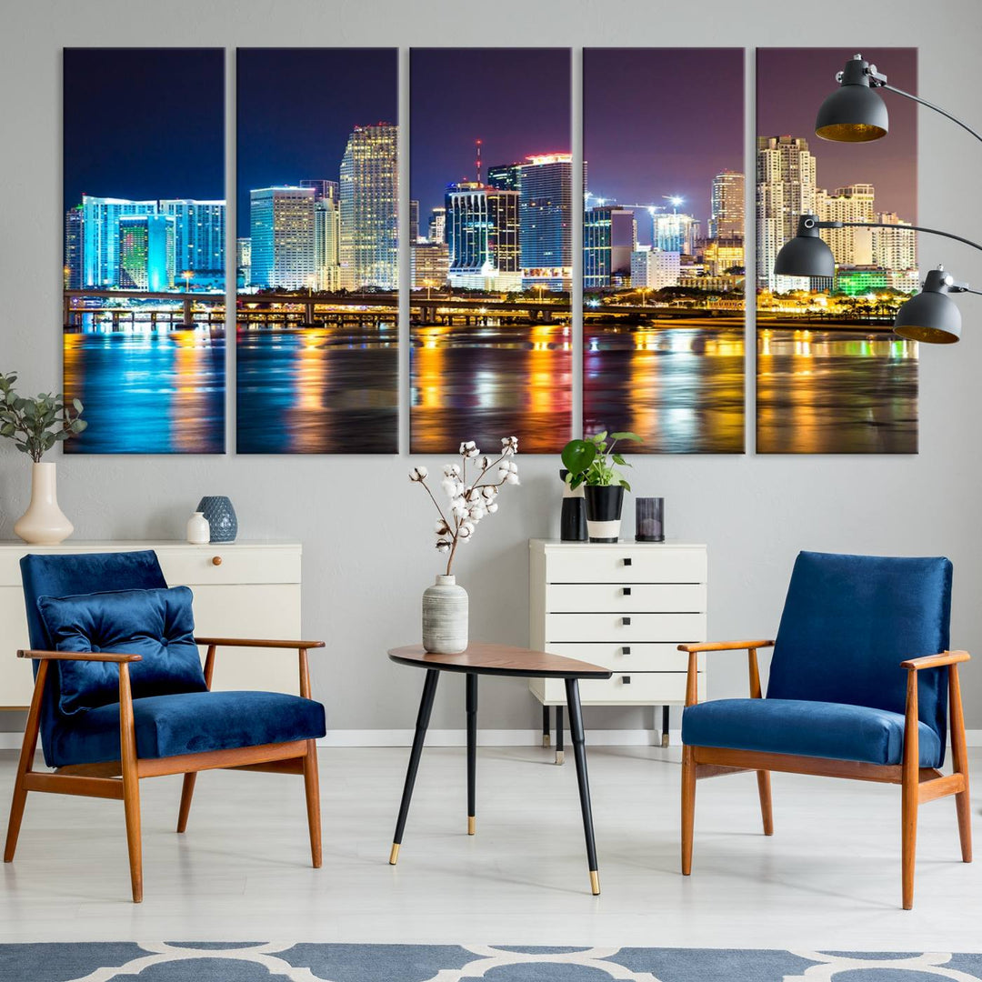 The Wall Art MIAMI Canvas Print features a stunning triptych of a city skyline at night, with vibrant lights reflecting on the water. This gallery-wrapped piece on museum-quality canvas delivers an exquisite finish.