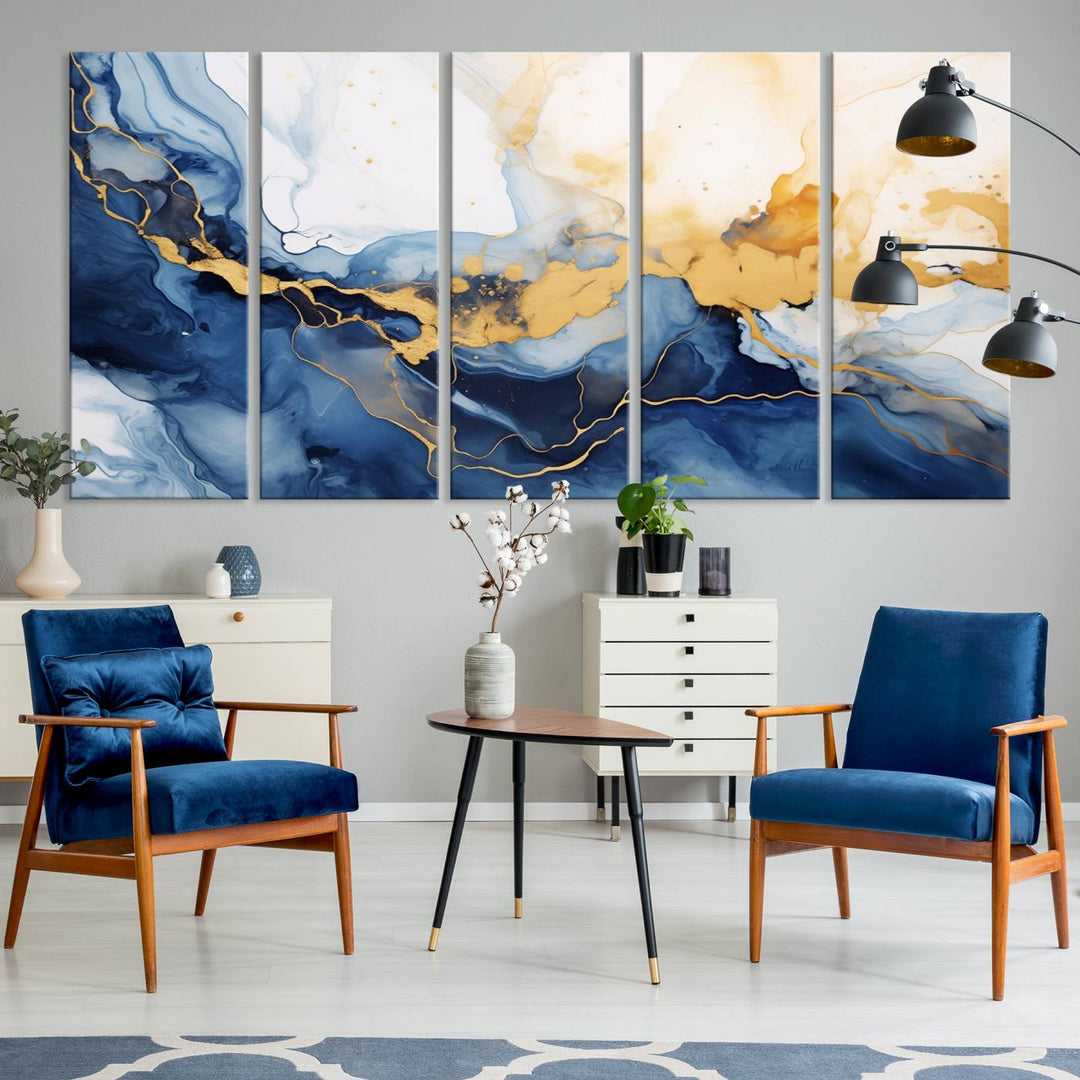 A contemporary living room featuring the "Navy Blue Gold Abstract Wall Art Canvas Print" on the wall, displayed on a gallery-wrapped, museum-quality canvas.