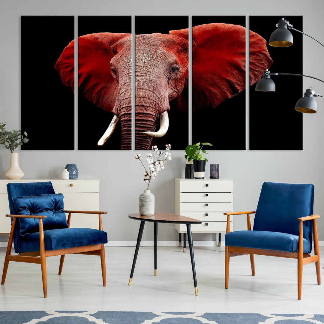 A Wall Art Canvas Print in the modern living room features a three-panel premium design of a red elephant face.