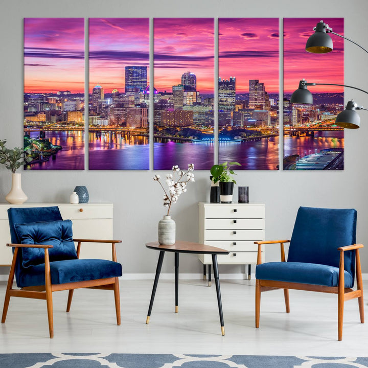 The Pittsburg Wall Art Canvas Print, showcasing a vibrant sunset glow over the city skyline and crafted by a professional artisan, adorns the space.