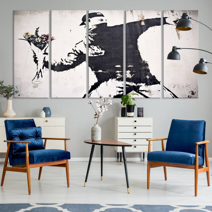 The living room features a split-panel art piece named "Banksy Flower Throw Graffiti Street Wall Art Canvas Print," gallery wrapped on museum-quality polycotton canvas and accentuated by modern decor elements.