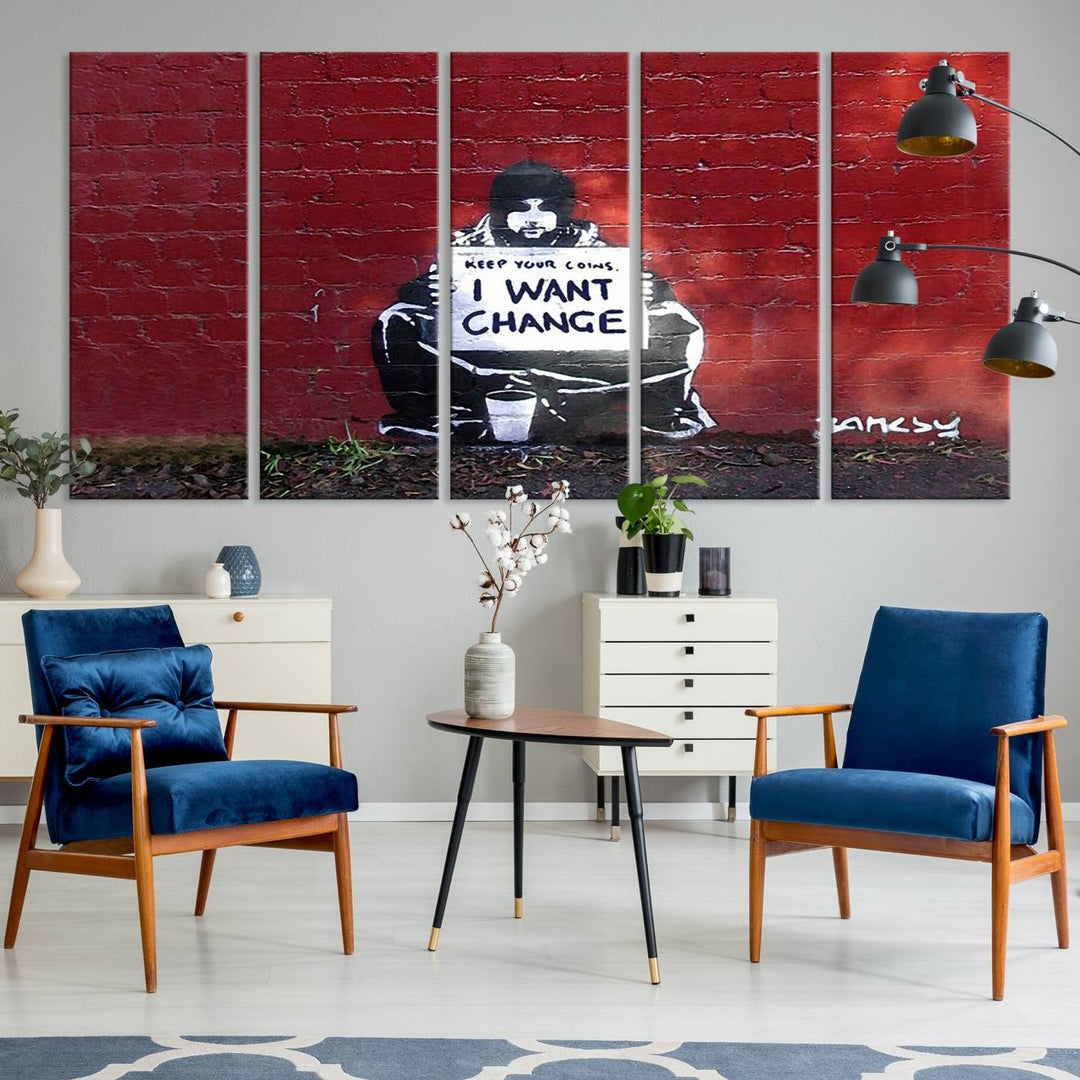 The living room showcases a triptych of stencil artwork on museum-quality canvas, featuring the Banksy I Want Change Graffiti Abstract Wall Art Canvas Print. This captivating piece depicts a person holding a sign that says "I want change" and is finished with a UV-protective coating to ensure long-lasting beauty.