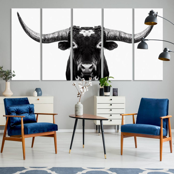 The living room is adorned with the Texas Cow Longhorn Wall Art Canvas Print in Black and White—framed and ready to hang.