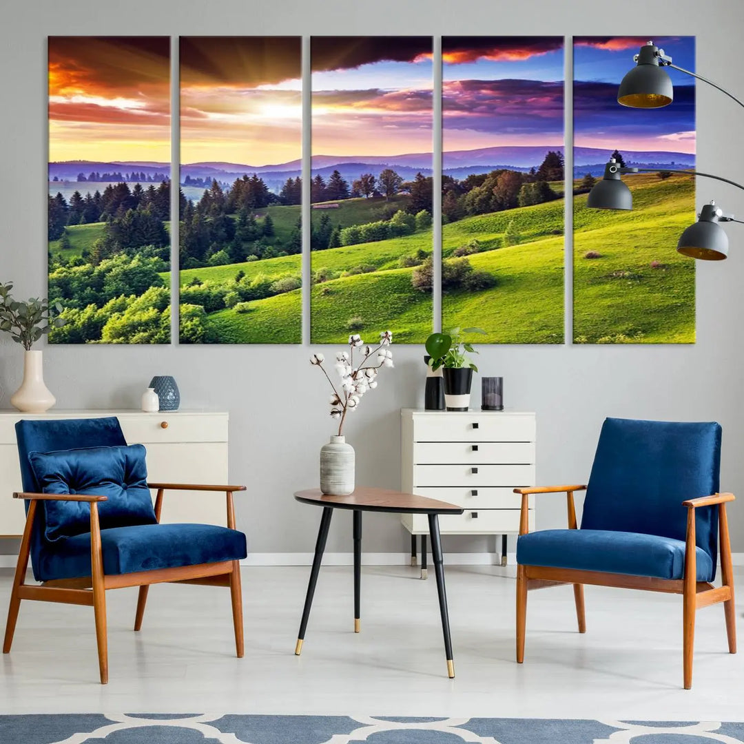 The room features a large triptych of the Green Hills and Sunset Wall Art Print, showcasing a scenic landscape with lush greenery and a vibrant sky.