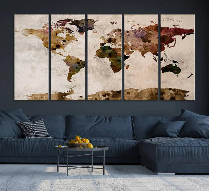 A Watercolor World Map Canvas Print, wrapped in an elegant gallery style, hangs on the wall.