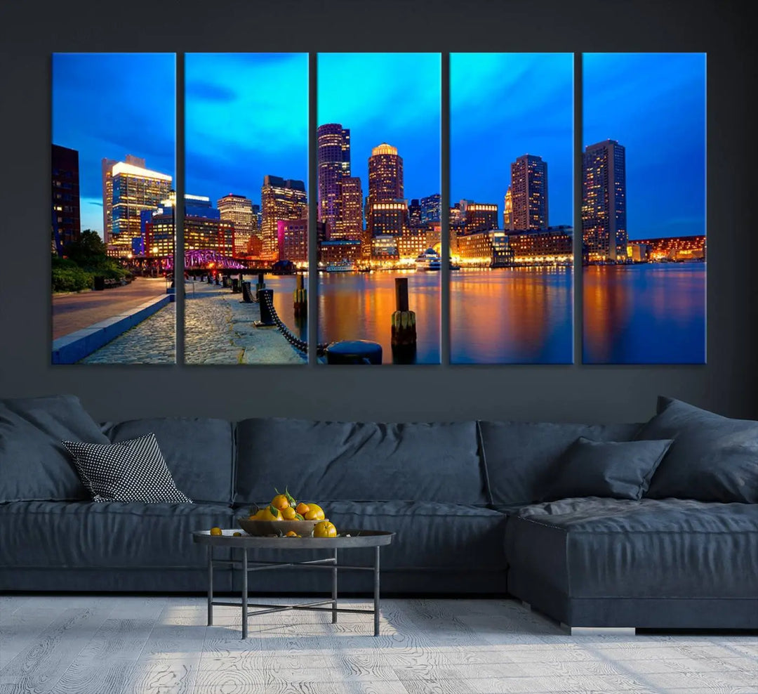 A triptych of the "Boston City Lights Night Blue Skyline Cityscape View Wall Art Canvas Print" adorns the wall. This museum-quality canvas artwork is ready to hang and includes a UV-protective coating for lasting brilliance.