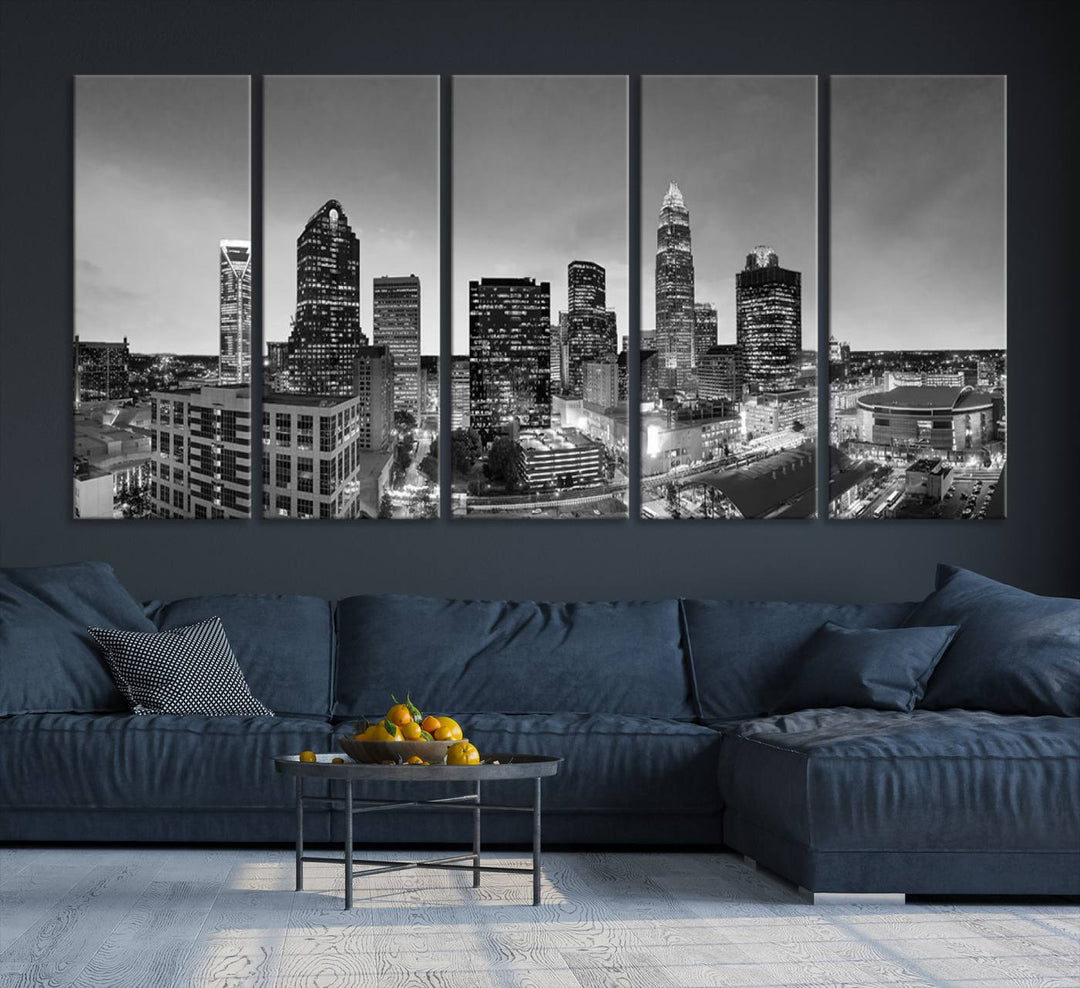 The "Charlotte City Cloudy Skyline Black and White Wall Art Cityscape Canvas Print" hangs on a dark wall, showcasing its UV-protective properties for enduring beauty.