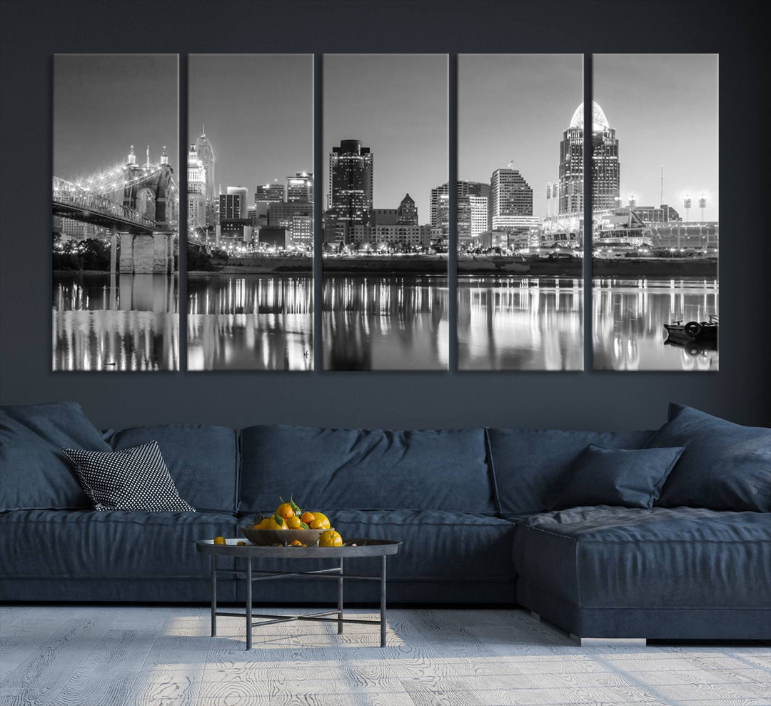 The "Cincinnati City Lights Skyline Black and White Wall Art Cityscape Canvas Print" is elegantly displayed in a stylish living room.