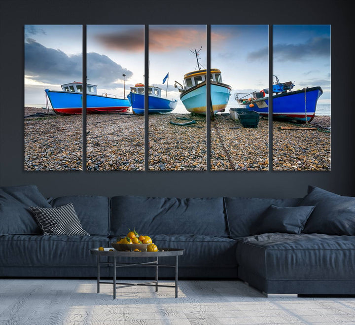 The "Big Boats On The Beach Wall Art Canvas Print" is a stunning piece featuring three museum-quality panels depicting fishing boats on a pebbled shore. Ready to hang and featuring UV-protective coating, it serves as an elegant addition to your home décor.