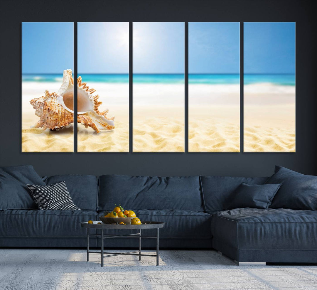 The Sea Shell on The Beach Sun Sand Wall Art Canvas Print is a triptych that beautifully captures a beach scene with a large seashell on the sand.