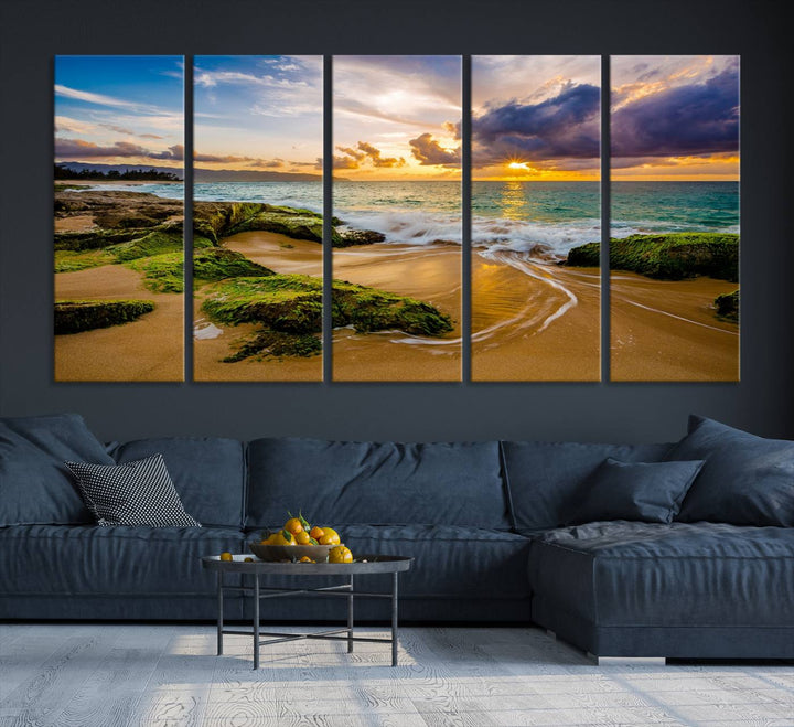 The Sunset Beach Wall Art Canvas Print is a gallery-wrapped triptych showcasing a beach scene with mossy rocks and a vibrant sunset. Made from museum-quality canvas and featuring a UV-protective coating, it elegantly provides both beauty and durability.