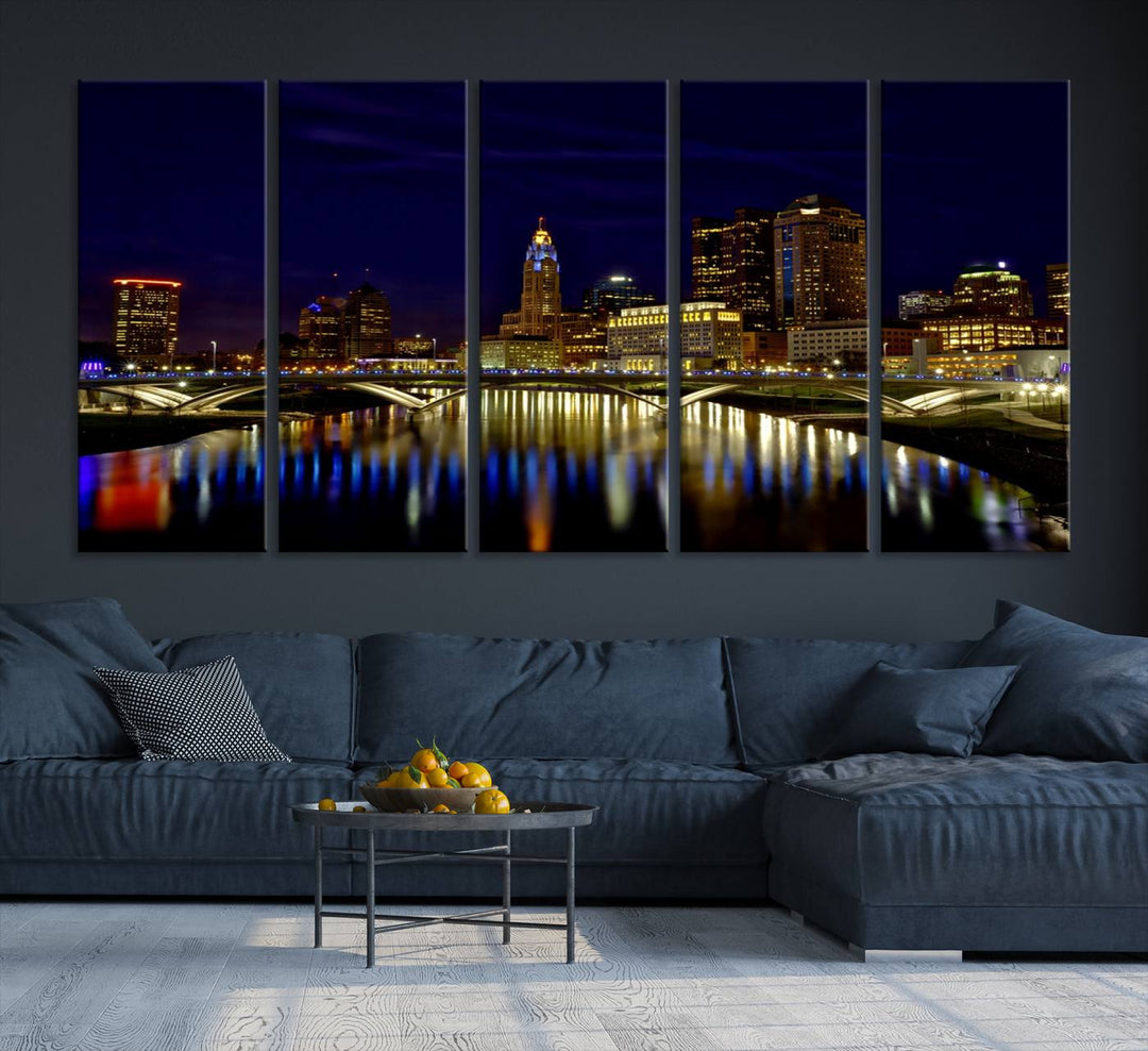 The "Columbus City Lights Night Skyline Cityscape View Wall Art Canvas Print" showcases a stunning city skyline at night, with illuminated buildings and bridges reflecting in the river, on a museum-quality canvas ready to hang.