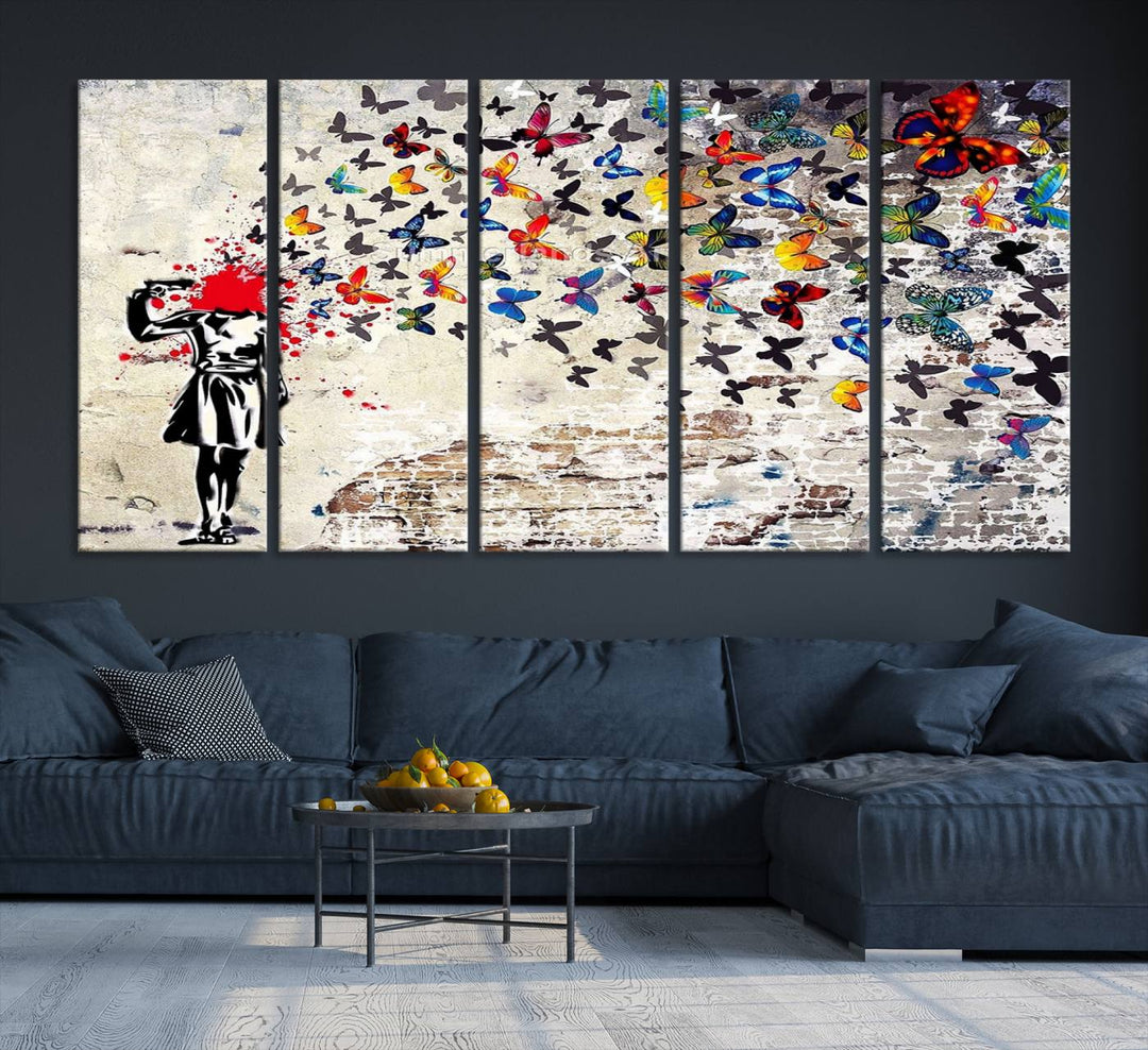 The Banksy Art Butterfly Girl Explosion Canvas showcases a dynamic figure with butterflies bursting from their head, set against a textured wall background. This vibrant urban graffiti piece is perfect for modern interiors and comes ready to hang.