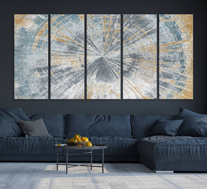 The Radiant Abstract Wood Rings Canvas Art, a modern triptych wall decor, enhances the contemporary style of the living room with its blue, white, and gold hues.