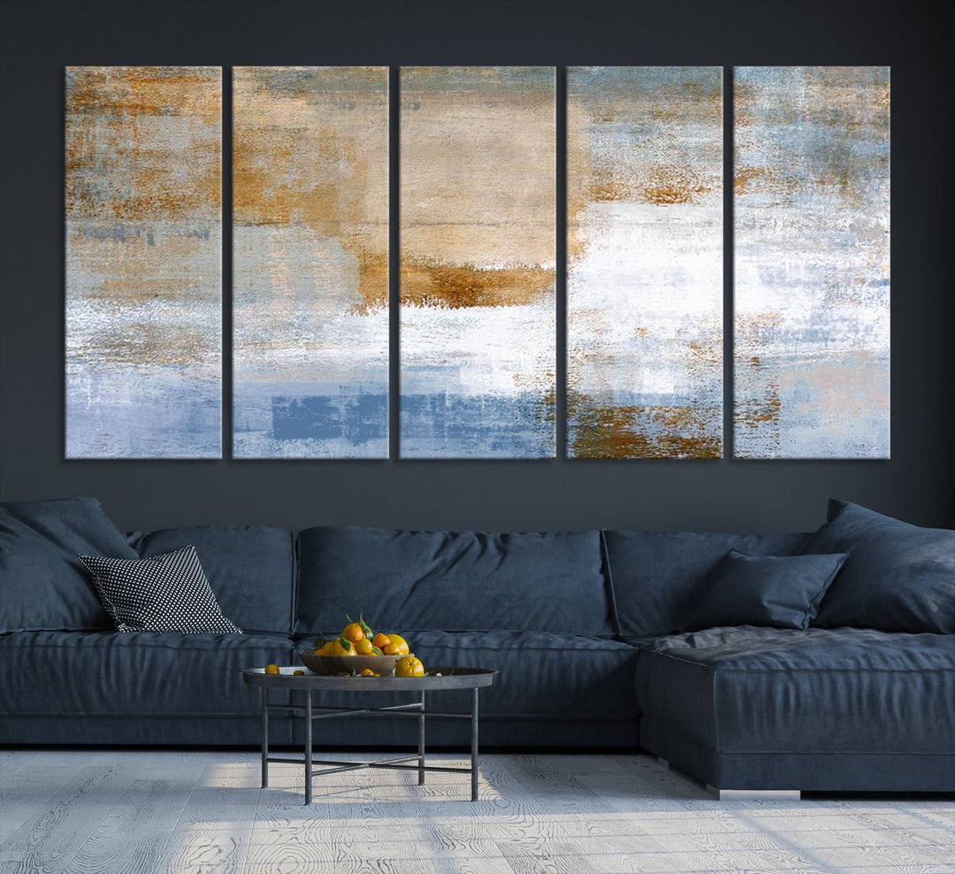 The Blue Multi Panel Abstract Wall Art Canvas Print, featuring an elegant blend of blue, beige, and brown tones, hangs gracefully on the wall, adding a contemporary touch to the space.