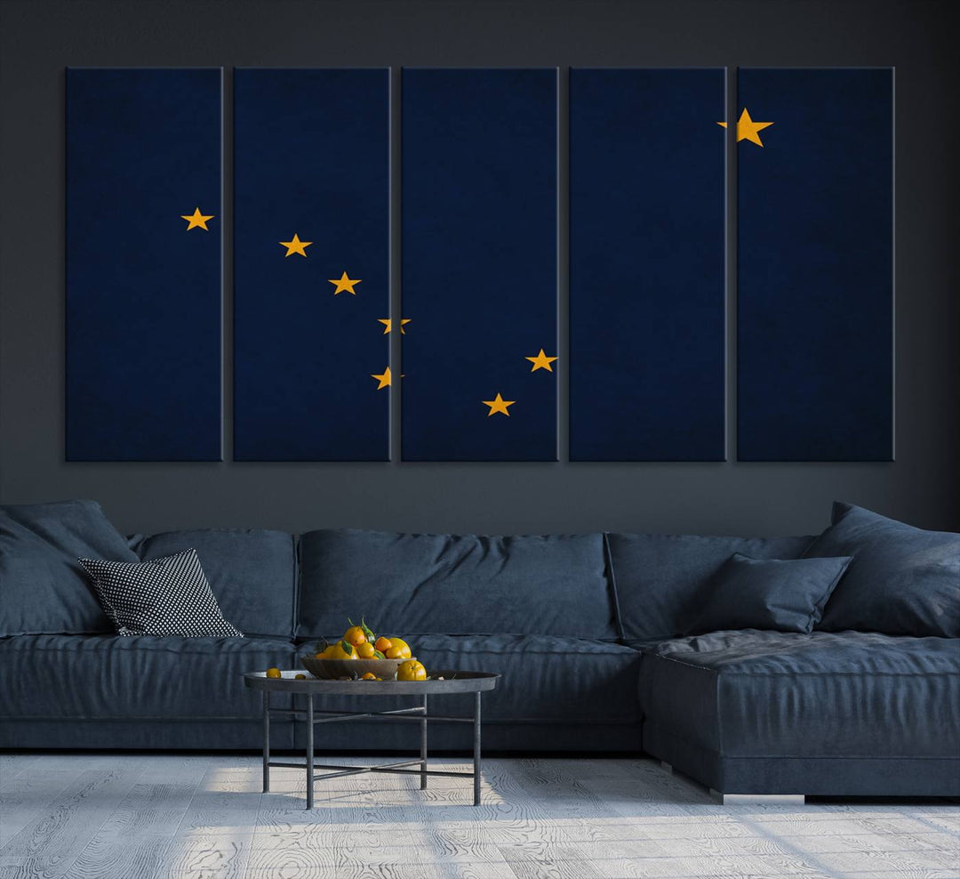 A contemporary living room featuring a triptych artwork of stars on a navy background, accentuated by the striking Alaska States Flag Wall Art Canvas Print.