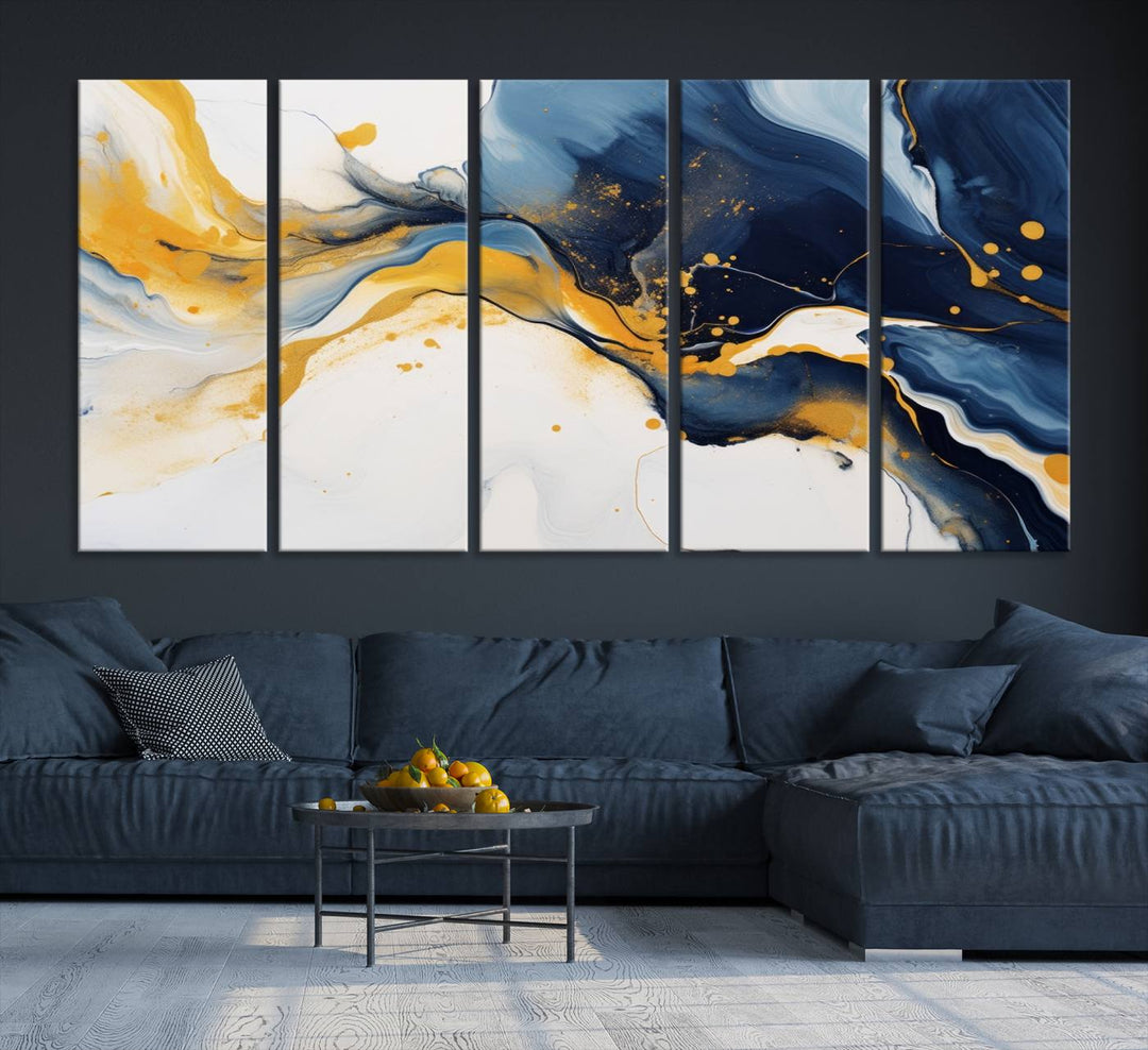 The Blue and Gold Abstract Fluid Canvas Art, with its swirling patterns, adorns the wall. This modern wall art beautifully complements the contemporary interior decor, adding an elegant touch with its rich blue, gold, and white tones.