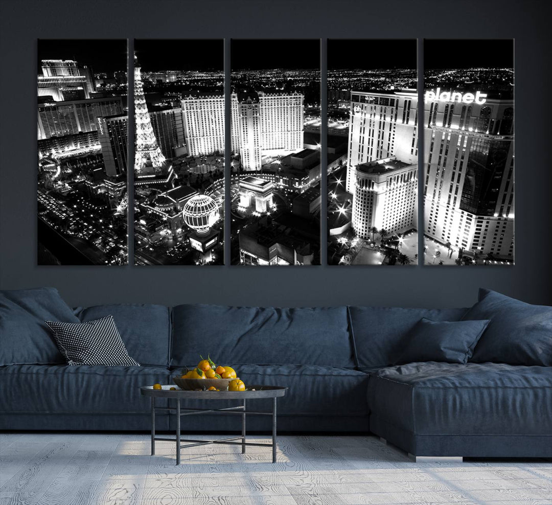 The Las Vegas Wall Art Canvas Print is a black and white triptych that showcases a city skyline at night. Crafted on museum-quality canvas with a UV-protective coating, it serves as an elegant and ready-to-hang focal point in the room.