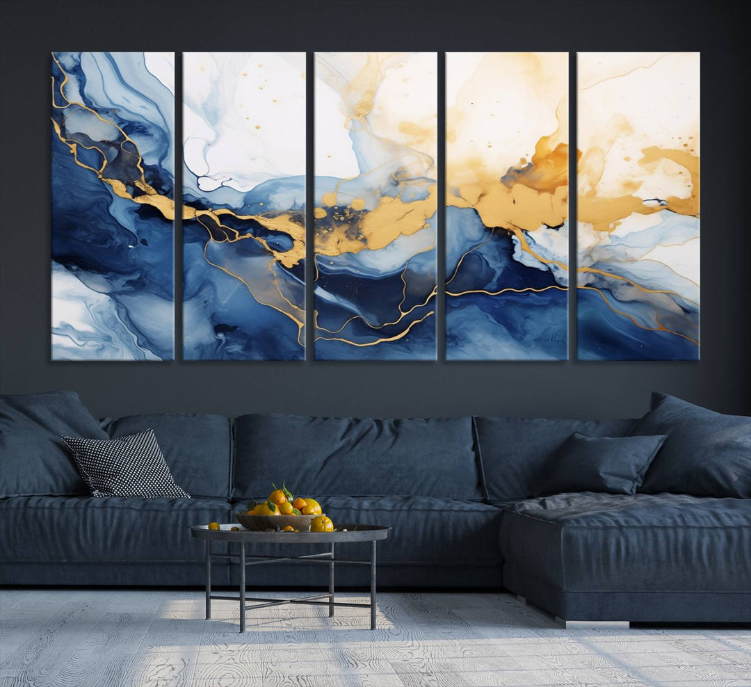 A contemporary living room featuring the "Navy Blue Gold Abstract Wall Art Canvas Print" on the wall, displayed on a gallery-wrapped, museum-quality canvas.