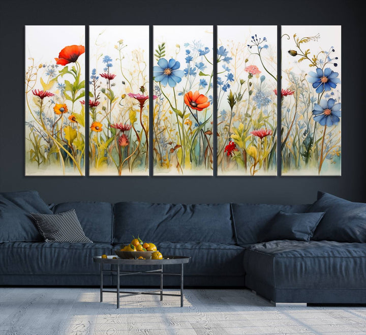 The Colorful Wildflower Canvas Wall Art – Vibrant Floral Botanical Print, consisting of a large 3 panel set, adds bright nature decor to the living room against a black wall.