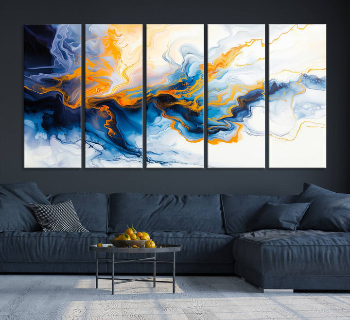 A stunning Fluid Alcohol Ink Wall Art with Gold Wall Art Canvas Print, featuring vibrant blue, orange, and white swirls, adorns the wall. This gallery-quality finish adds an exquisite touch to any living space.