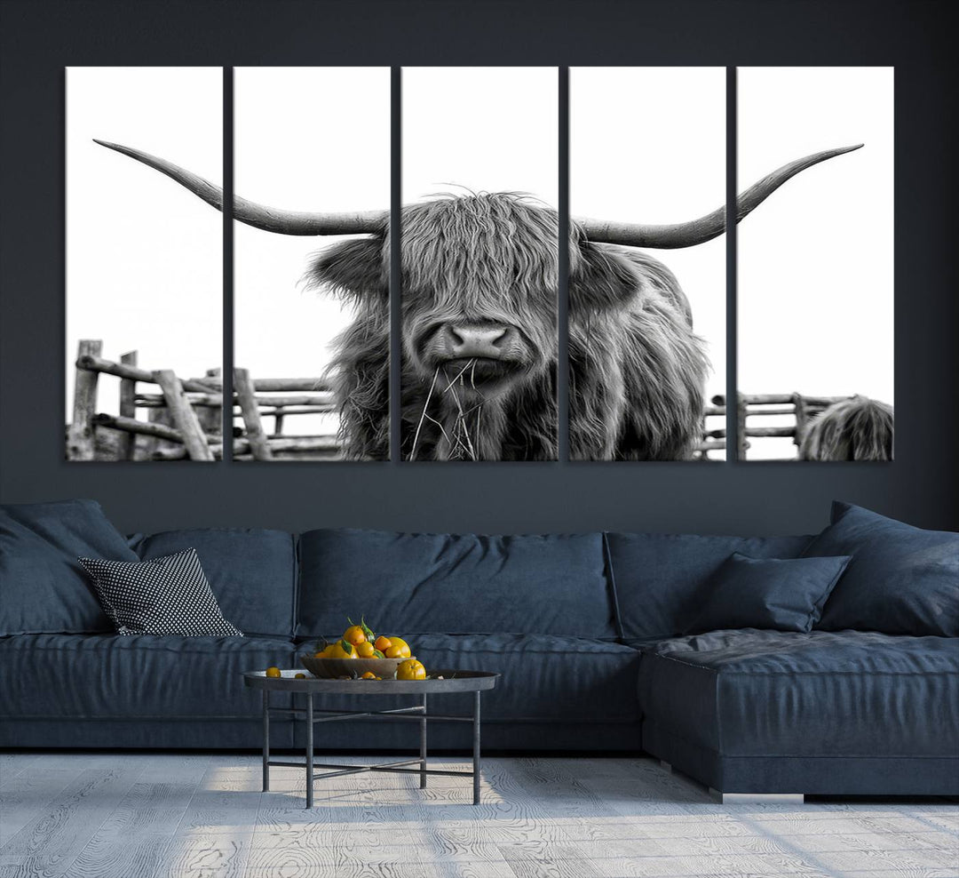 The Longhorn Canvas Print, featuring a black-and-white triptych of a Bighorn cow with shaggy fur and impressive long horns, is elegantly showcased. This wall art piece boasts a gallery-quality finish on premium canvas, bringing sophistication to any room.