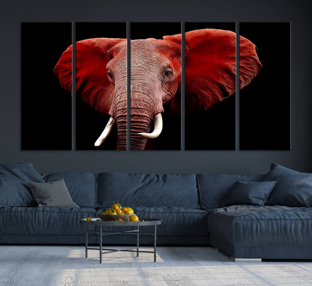 A Wall Art Canvas Print in the modern living room features a three-panel premium design of a red elephant face.