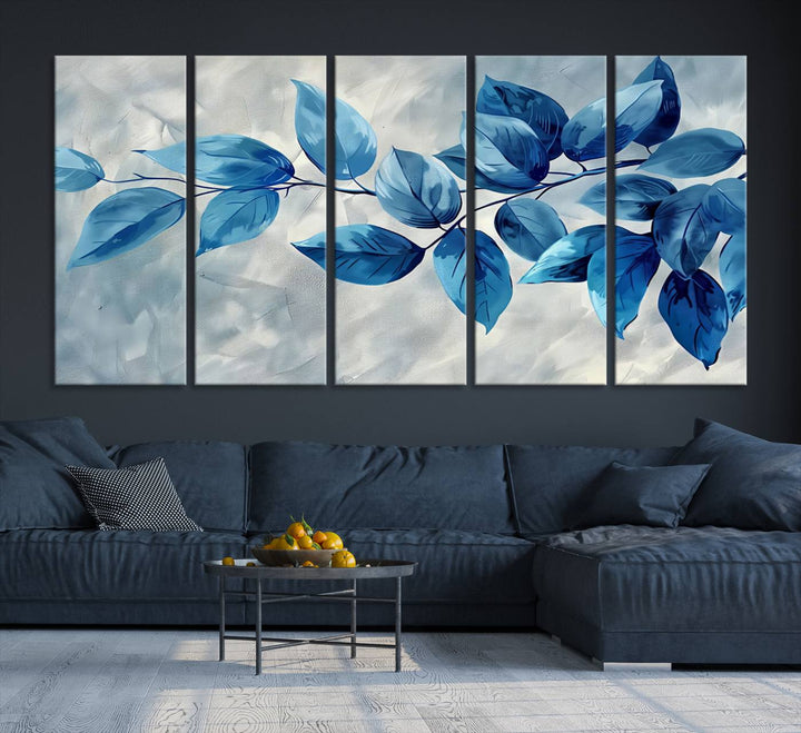 A Blue Leaf Abstract Wall Art Canvas Print, featuring a textured background and gallery-quality finish, is displayed.