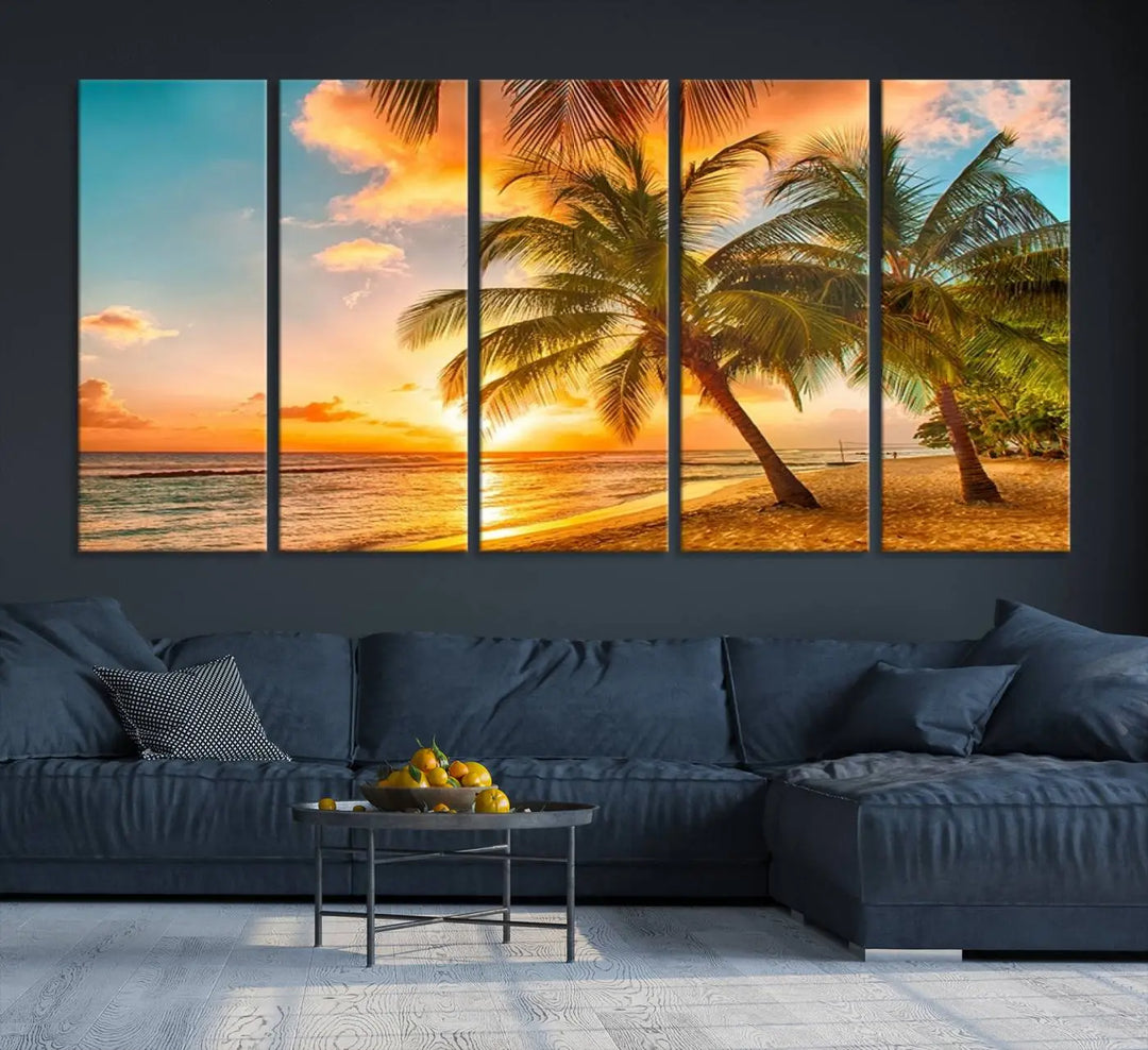 The Tropical Sunset Wall Art Print features a vibrant beach scene with palm trees and an ocean view highlighted by a golden sunset.