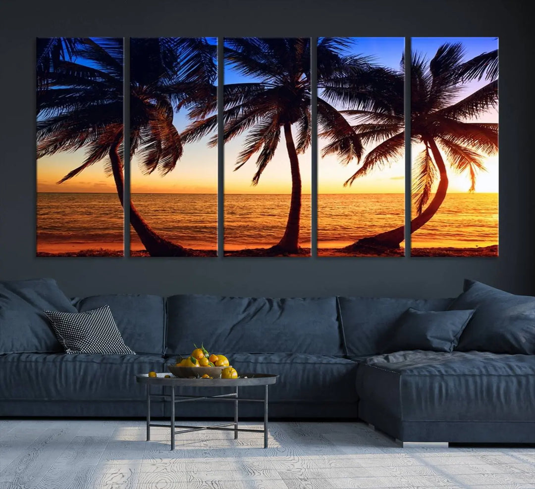 The living room features a wall adorned with the "Wall Art Canvas Curve Palms at Sunset on Beach," showcasing gallery-wrapped, museum-quality canvases in a stunning triptych.