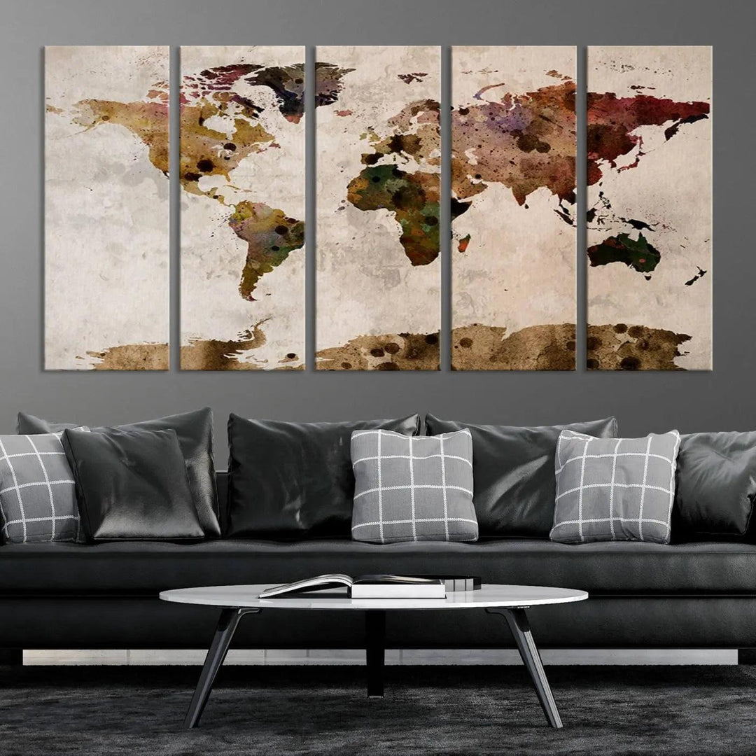 A Watercolor World Map Canvas Print, wrapped in an elegant gallery style, hangs on the wall.