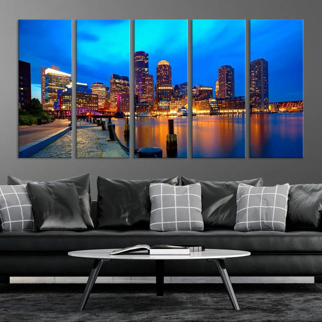 A triptych of the "Boston City Lights Night Blue Skyline Cityscape View Wall Art Canvas Print" adorns the wall. This museum-quality canvas artwork is ready to hang and includes a UV-protective coating for lasting brilliance.