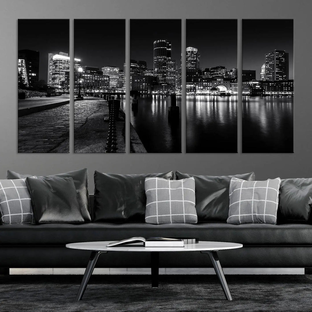 The Boston City Lights Skyline Black and White Wall Art Cityscape Canvas Print portrays a triptych of the city skyline at night reflecting on a calm river. This museum-quality canvas features UV-protective finishes to preserve its timeless allure.