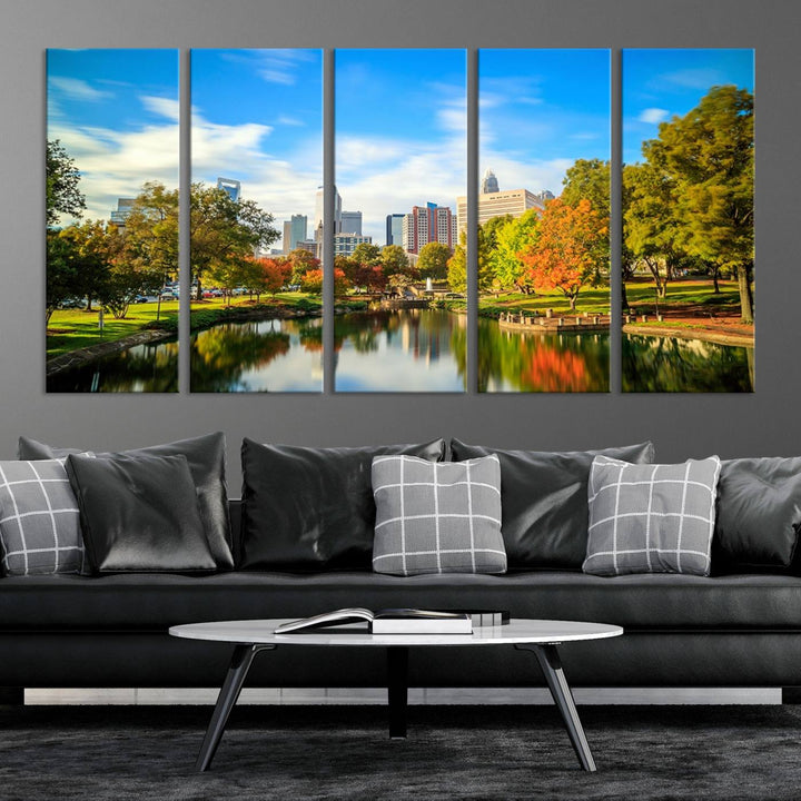 The Charlotte City Park at Spring Skyline Cityscape View wall art canvas print is a triptych featuring a scenic park with a lake and city skyline. It is gallery-wrapped on museum-quality canvases.