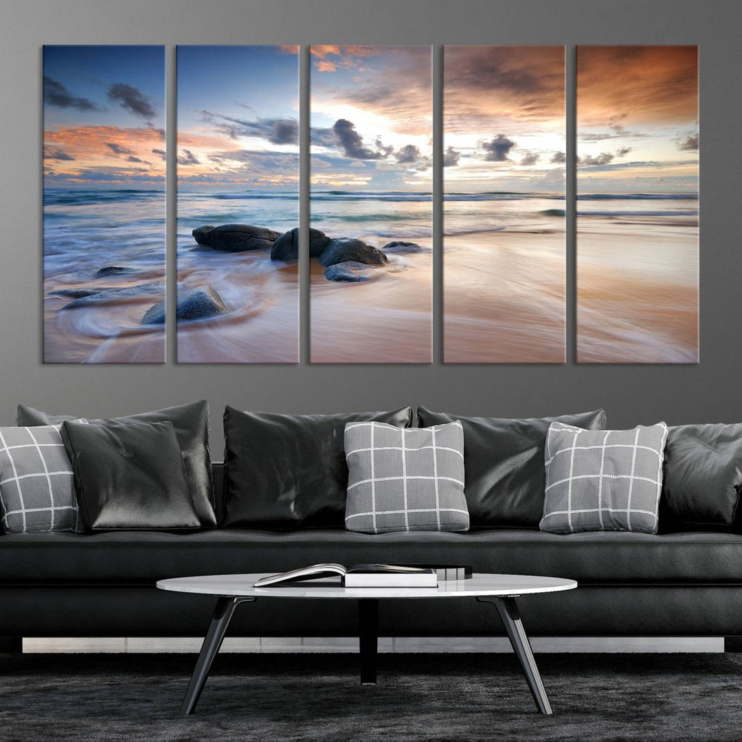 The "Serene Weather On The Beach Wall Art Canvas Print," featuring a tranquil beach scene with rocks and waves, is ready to hang and enjoy.